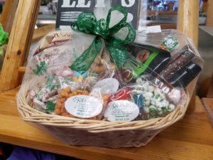 A unique, custom gift basket featuring Mitchell's Gourmet Deli & Market's favorite treats, including, carmel puff corn, Amish meat sticks from local farmers and more.