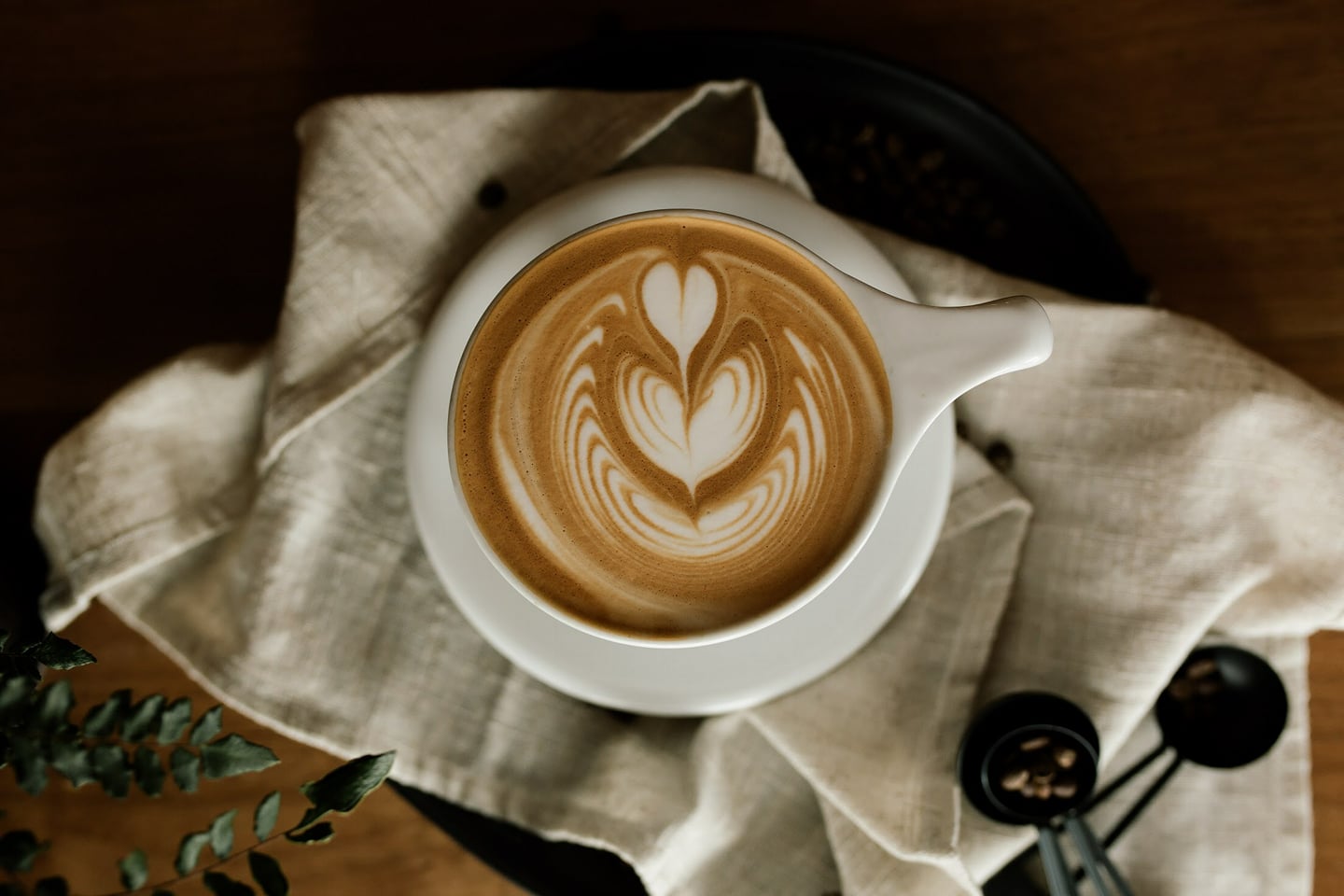 Ponder Coffee Company latte, with a beautiful heart-shaped leaf design created with foam.