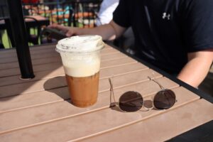 An iced coffee on Ponder's outside patio.