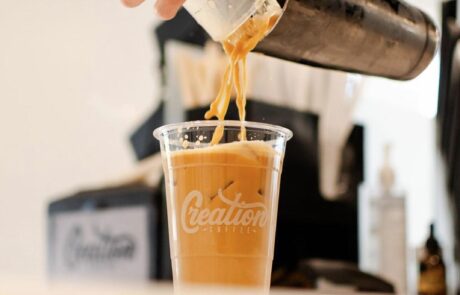Pouring iced coffee.