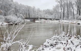 A beautiful, snow-covered Mt. Pleasant City Park in the winter, featuring the chippewa river and bridge; Photo credit: Instagram fan @maeganmlk