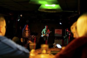 A band performs in a dimly lit room at Rubble's Bar in Downtown Mt. Pleasant, Michigan.