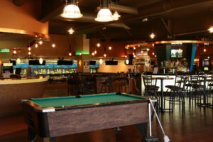 Pool table and bar area inside Riverwood.