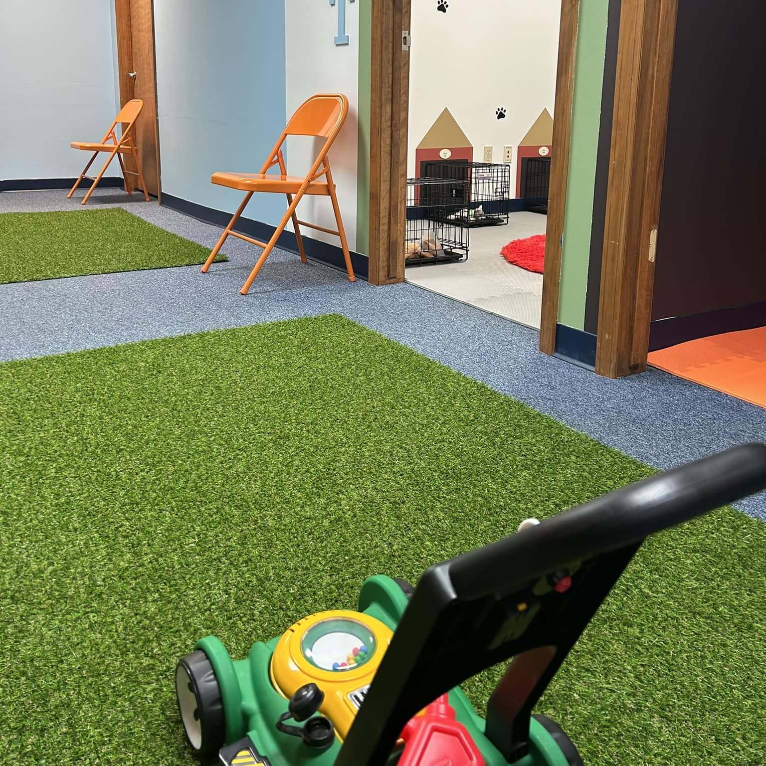 Mini City play area and lawn mower.