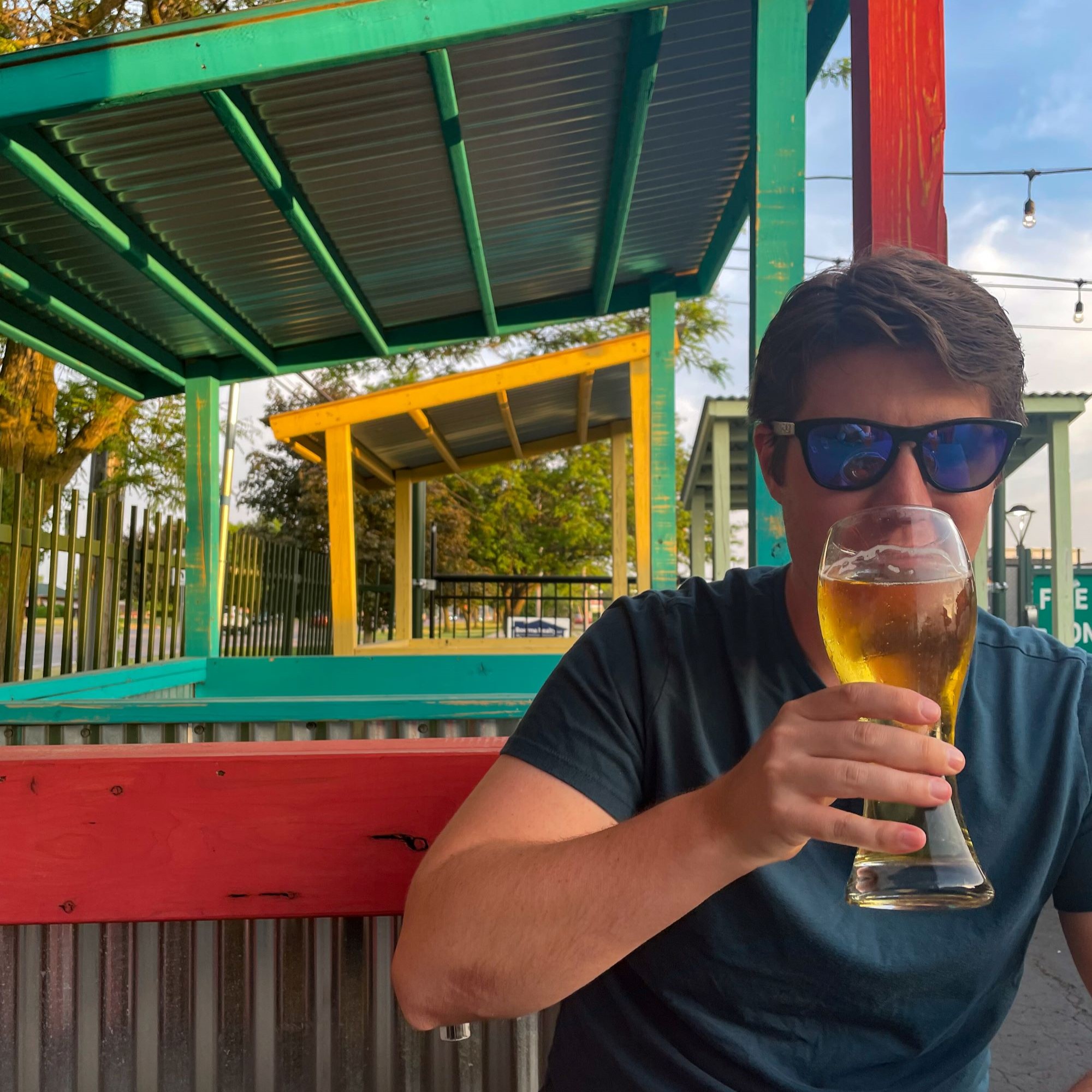 A patron enjoying a beer on the O'Kelly's patio.