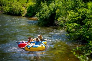 Friends floating on tubes on Chippewa River