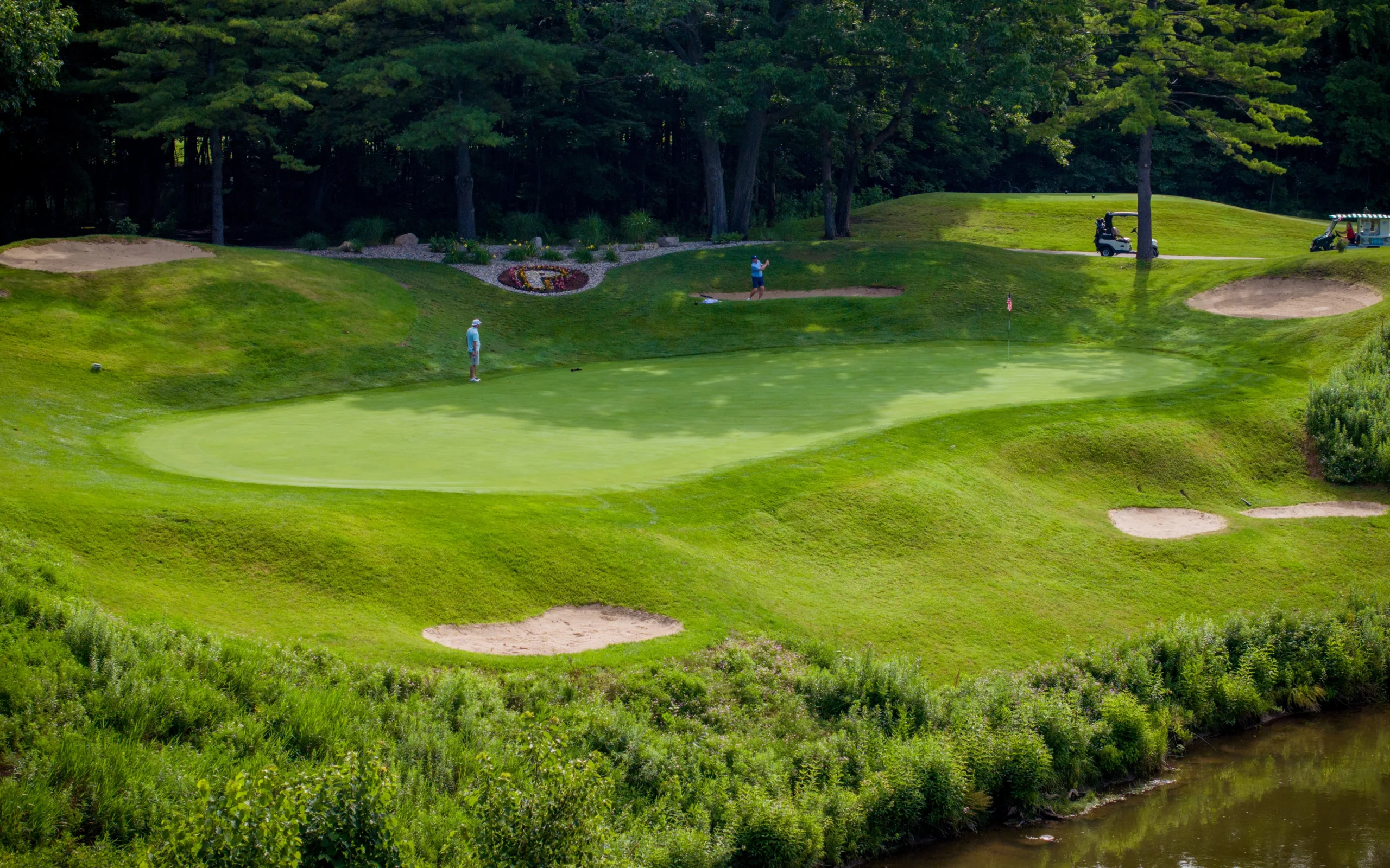 Group of men golfing on PohlCat Golf Course